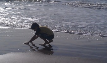 My son playing on the Texas Gulf Coast beach.