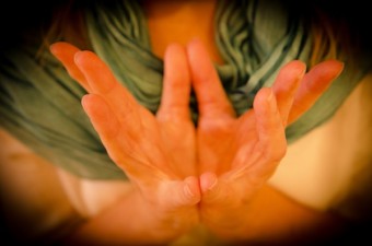 The lotus "mudra" (Yoga of the hand) is said to open the heart. Jen Lemen took this photo of me last fall. 
