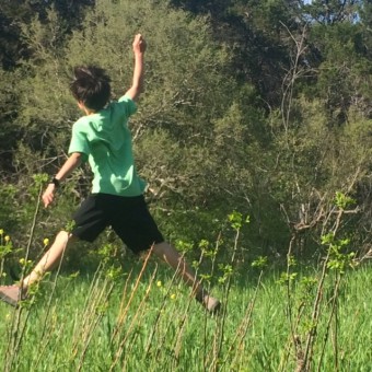 My son enjoying spring weather; my family made the choice to live near a greenbelt as nature is a big part of our lives. 
