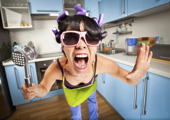 crazy housewife in an interior of the kitchen
