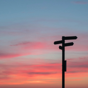 silhouette of signpost at sunset